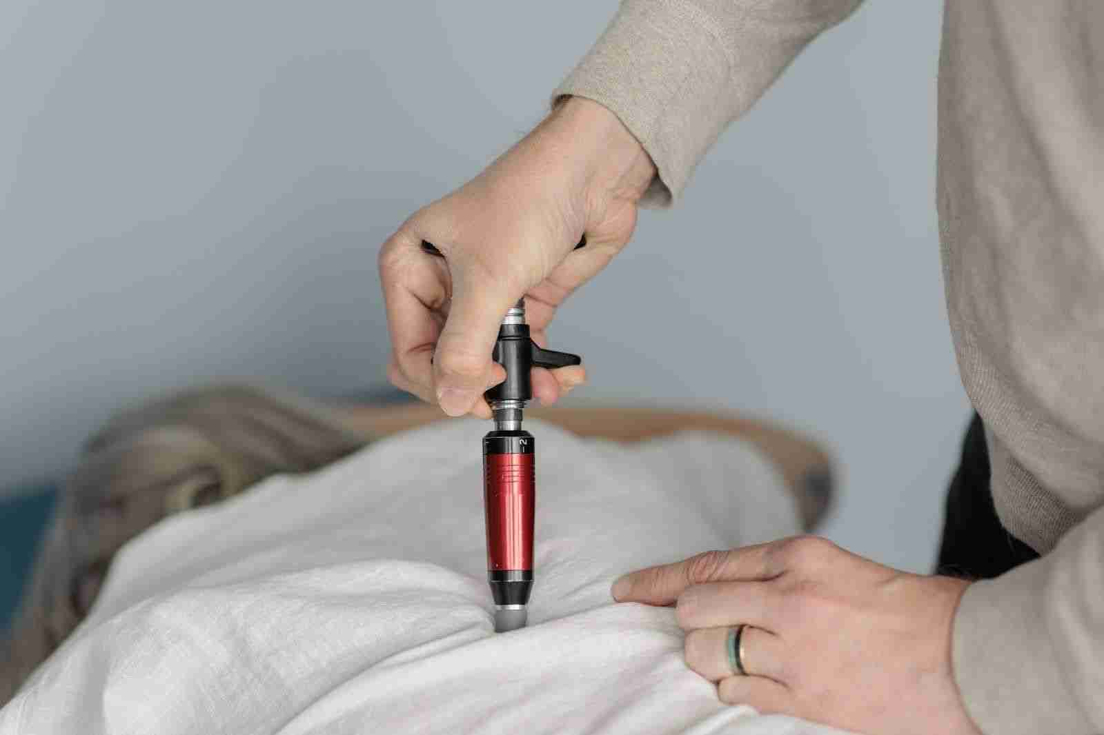 A person uses an electric device to assist another with mobility